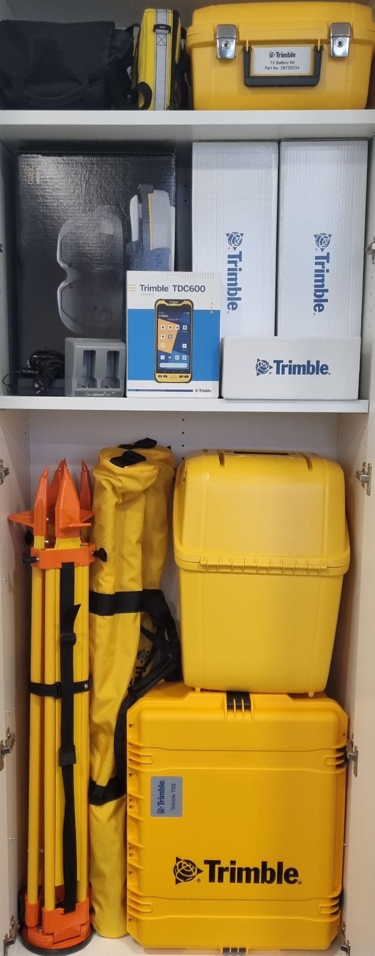 A picture of the Trimble Hardware stacked in a large cupboard.